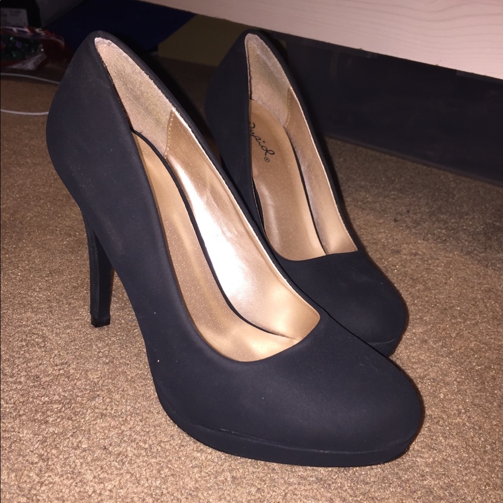 Black suede pumps